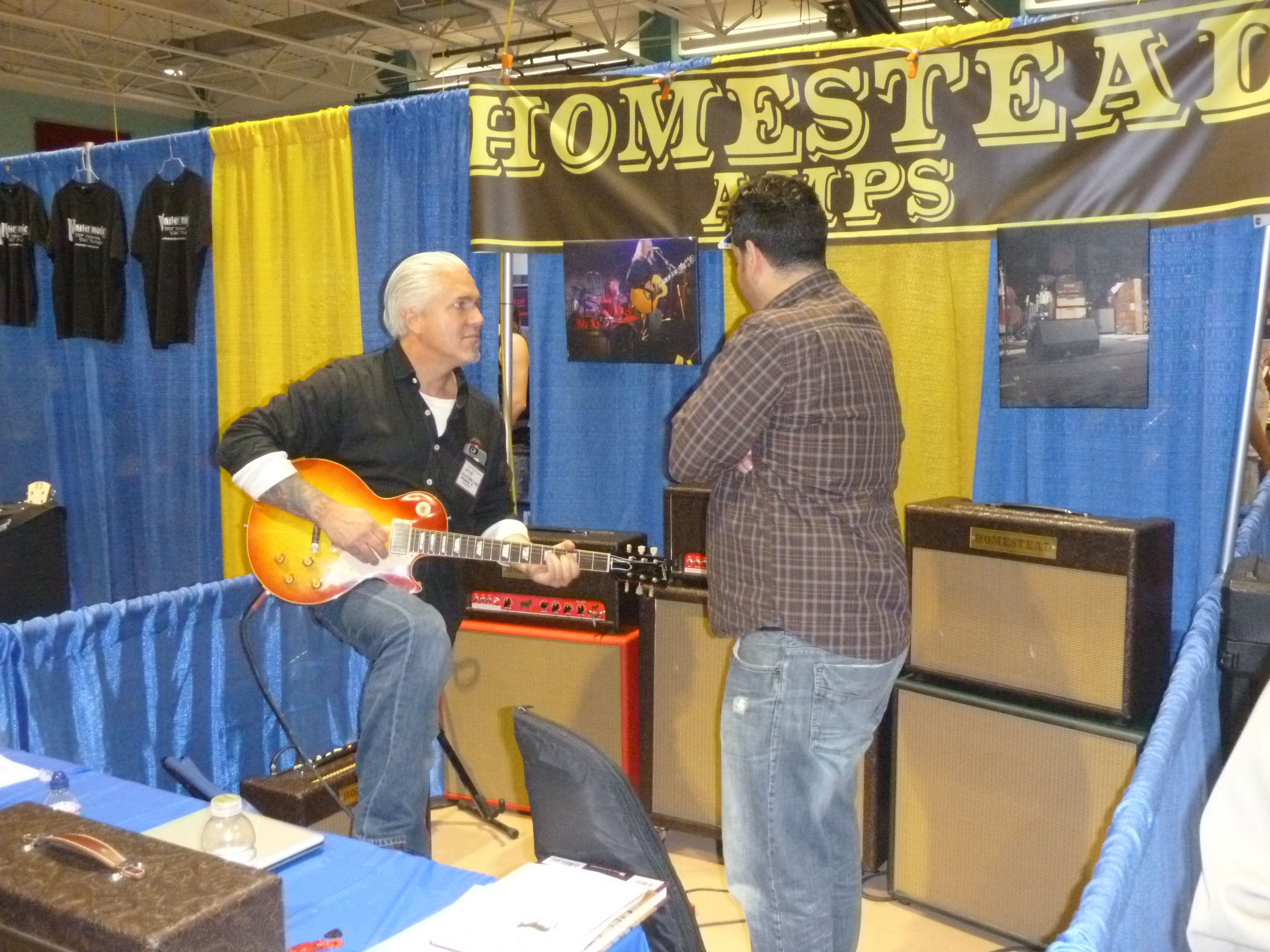 Getting a tone check at the Homestead Amps booth.