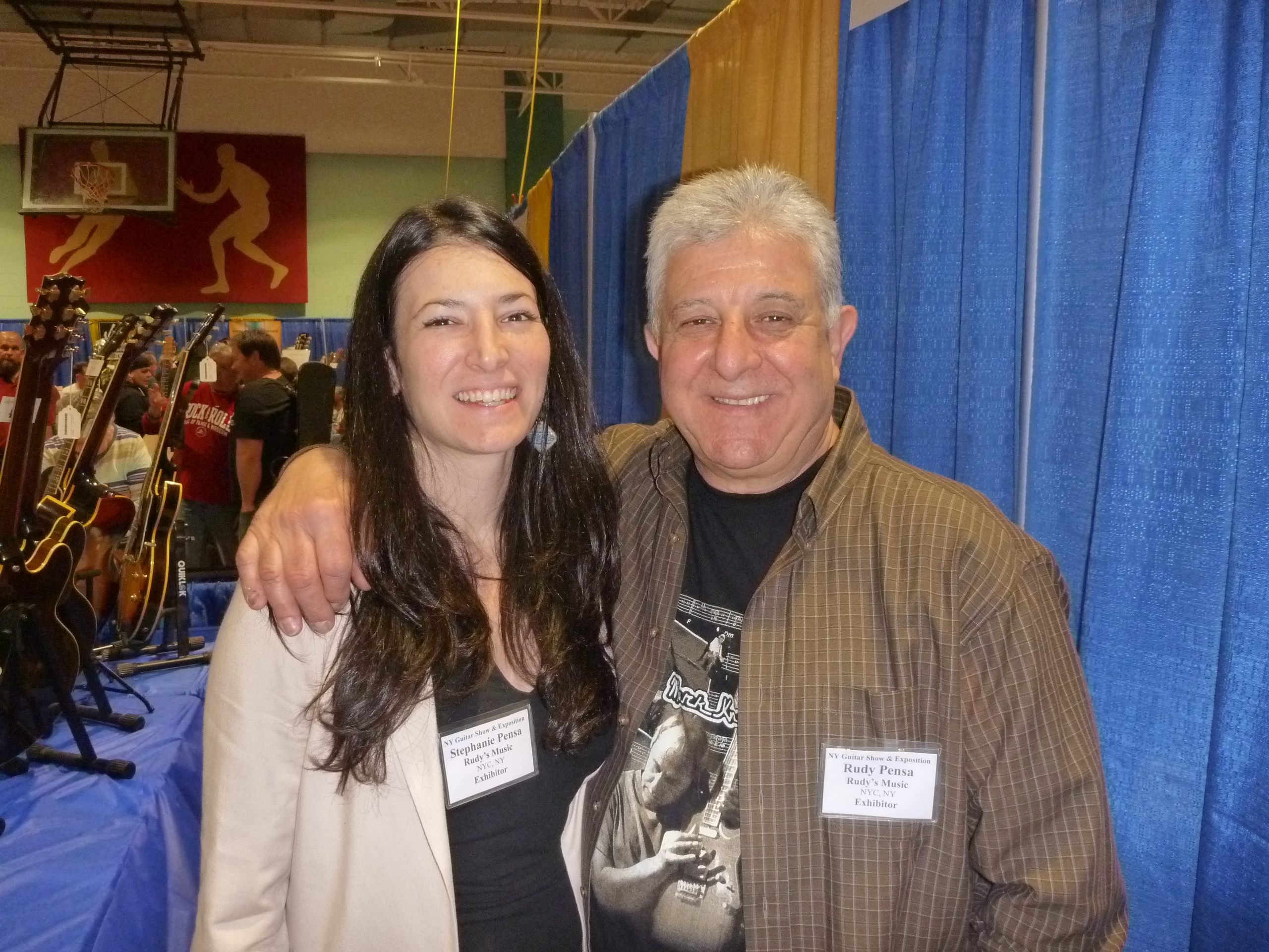 Stephanie Pensa and dad, Rudy, share a family moment in-between the chaos and crowds at the 4th NY Guitar Show.