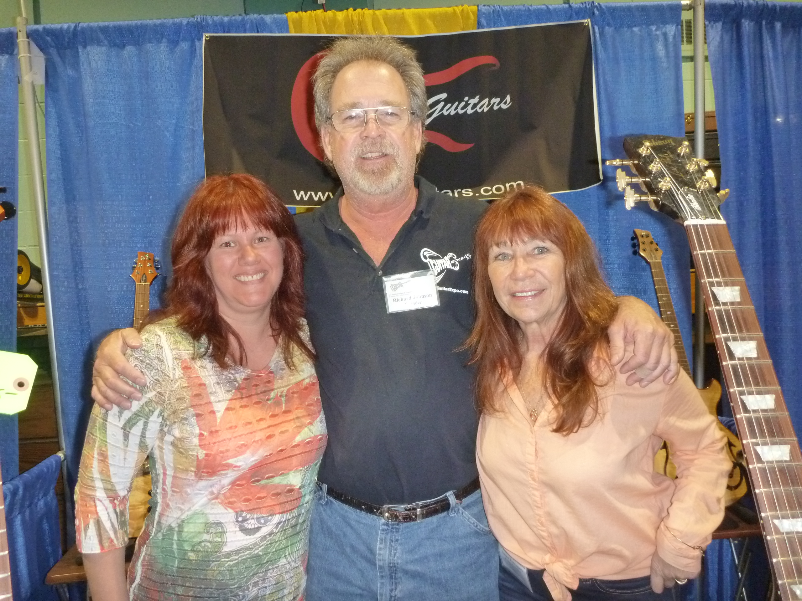 Founder Rich Johnson with the girls at the Ferro Custom Guitar booth.