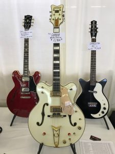 1962 was a great year! A '62 Gretsch White Falcon Stereo (center), a 1962 Gibson ES-335 (left) and a Danelectro DC-1 (right)