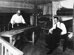 Francisco Simplicio (left) and son, Miguel, applying French polish in their shop.