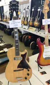 A 1960 Harmony Stratotone and a '79 Fender Strat