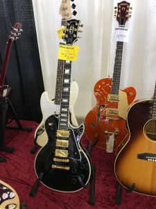 A Les Paul Black Beauty and a Gretsch 6120