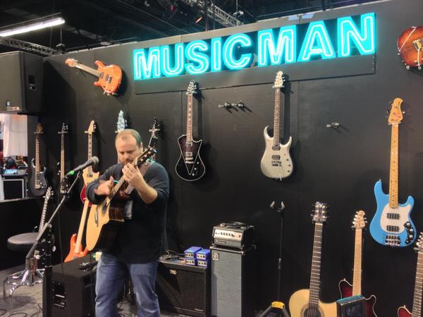 Andy McKee performing at the Ernie Ball booth