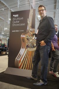 NAMM dedicated a display boutique builders. Here’s curator Jamie Gale with a polished aluminum beauty.