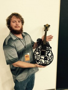 This #mandolin is made of dark amethyst blown glass and was made by Nick and Gibbie of Classical Creations. #vintageguitar #ocguitarshow #ClassicalCreations — in Costa Mesa, California.