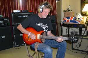 Guitarist Dana Olsen jamming at Fryette Amplification.