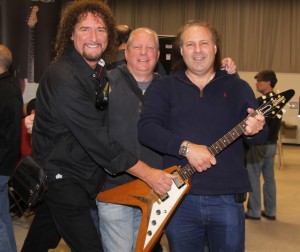 Drew Berlin with Dave Davidson and Richie Friedman of We Buy Guitars with a '58 Gibson Flying V.