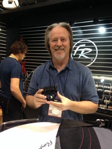 Floyd Rose holding his surface-mount model, the FRX.