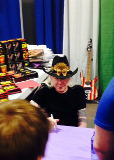 Johnny Winter signing autographs at the DR Strings booth.