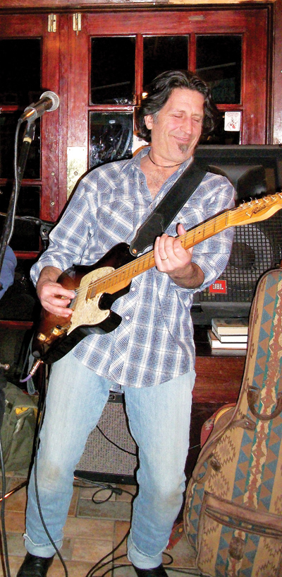 Kilby with his custom guitar made by Richie Baxt. Geoge Kilby, Jr.: Katy Keen.