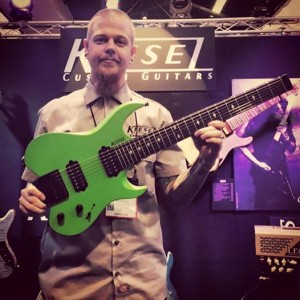 Jeff Kiesel with the new #Kiesel Vader seven-string in a matte Kiesel Racing Green finish! This beauty weighs in at only six pounds. #vintageguitar #Carvin #guitar#guitars #NAMM15 #NAMM2015 #vintageguitarmagazine