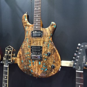 Yes, you're seeing spots on this First Severn with spalted top and inlaid stone - spots of real turquoise! Learn more about this Tier 3 Trembuck atKnaggsGuitars.com. #knaggsguitars #guitar#vintageguitar #NAMM2015 #NAMMShow #NAMM15#NAMM — in Anaheim, California.