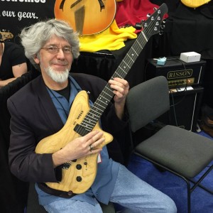Don Latarski showing off one of Ralph Novak's Fan Fret guitars. #NAMM2015? #VintageGuitar #NovaxGuitars #Novax — in Anaheim, California.
