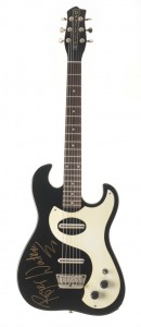 R. Waters-signed Danelectro Model 6 Danelectro auctioning guitars for orphanage charity.