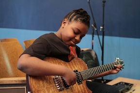 Taylor pledges guitars to Little Kids Rock.