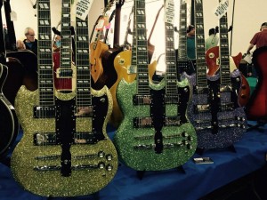 These Tokai double necks are custom finished by Marty Bell. #guitarlove #guitars #vintageguitar #Tokai #ocguitarshow — in Costa Mesa, California.