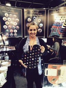 Vivian Molina from Q-Parts with a few of their custom #guitar knobs. #NAMM2015 #vintageguitar #guitarlove #guitargear — in Anaheim, California.