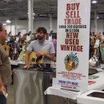 Jeremy Cain, Cream City Guitars' guitar tech, helps customer.