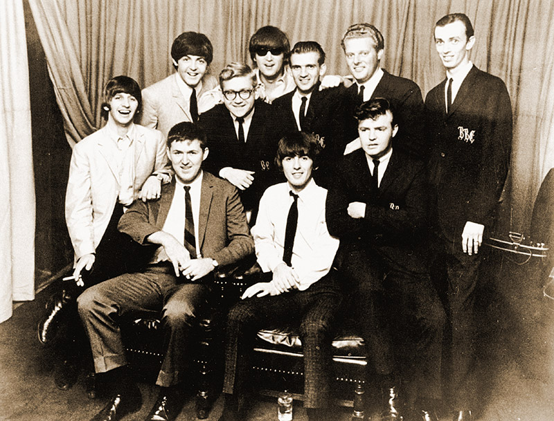 Young and the Bill Black Combo, with the Beatles in 1964. Young is standing second from right.