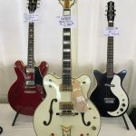 1962 was a great year! A ’62 Gretsch White Falcon Stereo (center), a 1962 Gibson ES-335 (left) and a Danelectro DC-1 (right)