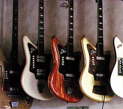The main hall of the museum. Some pieces that appear to be modified (such as the four-pickup model [LOWER LEFT]) are actually stock. If Lord Bizzare finds an album showing one of his guitars, he displays it near the instrument.